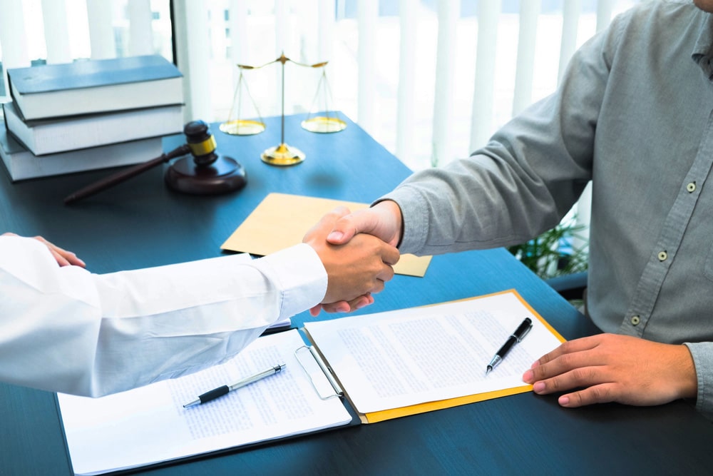 Lawyer Shaking Hands with Client